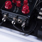 Straight and right-angle IVU patch cables connected to pedalboard equipment