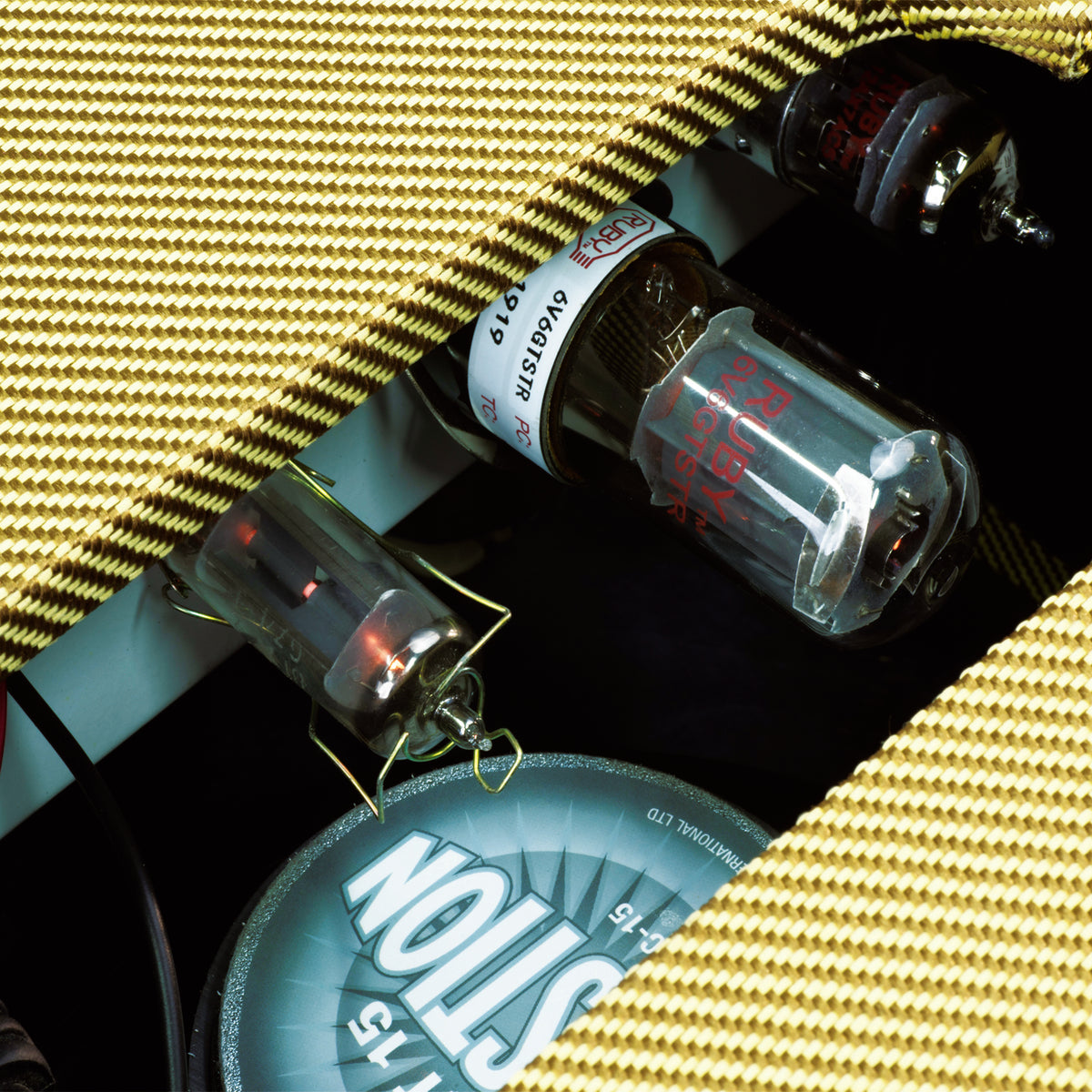 Close-up of tubes and Celestion speaker inside IVU Oxblood GTA-5 5W amplifier