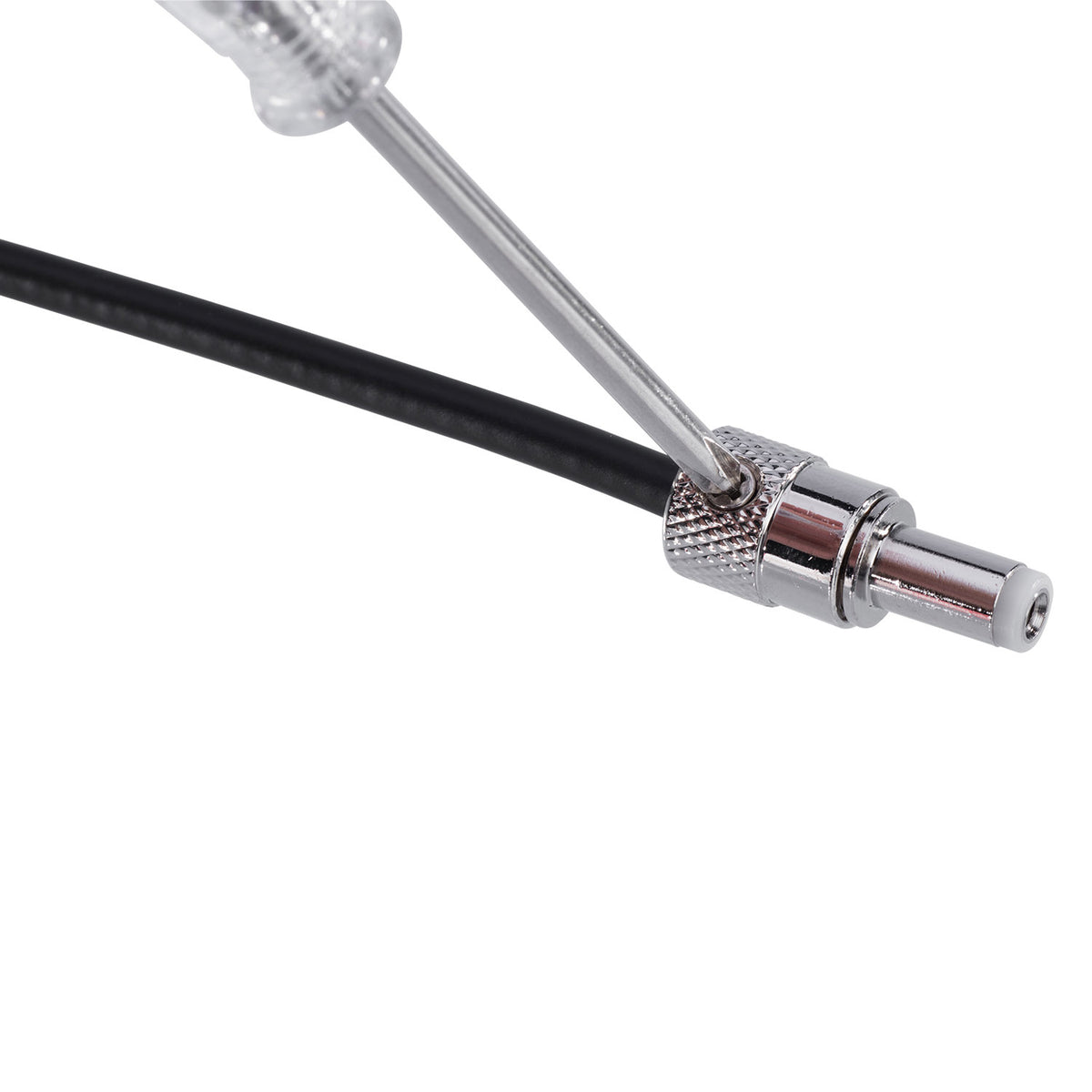 Securing black DC wire inside an IVU POK-03 solderless plug with a screwdriver