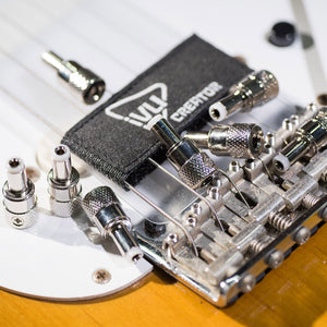 Compact IVU solderless DC plugs displayed with pedalboard hardware