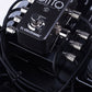 Compact solderless DC plugs and custom power leads beside a guitar looper pedal